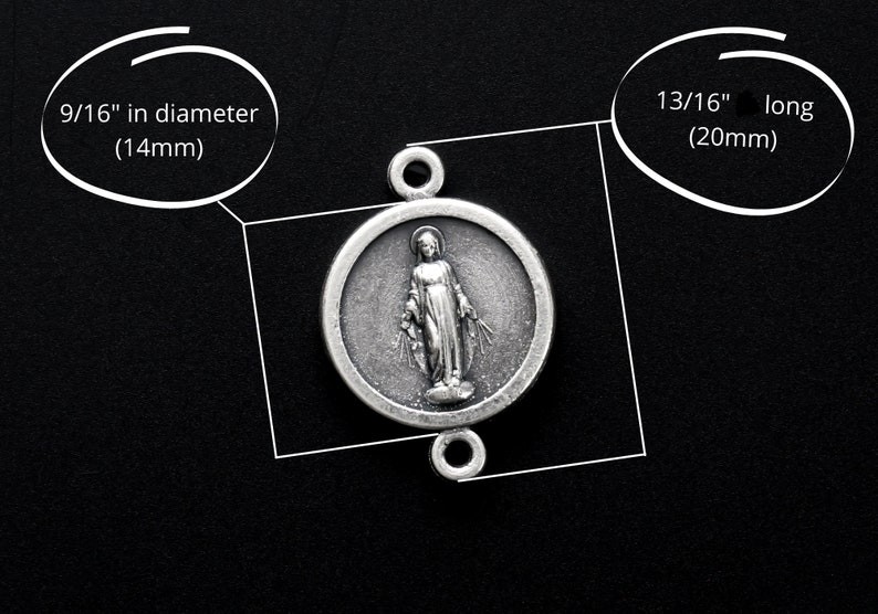 May include: Silver charm featuring a depiction of the Virgin Mary, 9/16" in diameter (14mm) and 13/16" long (20mm).
