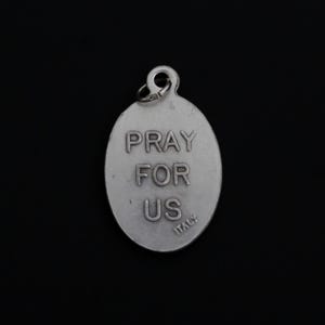 May include: Silver oval charm with the words "Pray for Us" and "Italy" engraved on the back.
