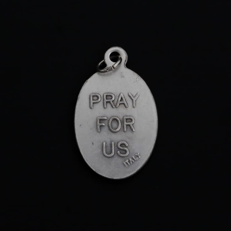 May include: Silver oval charm with the words "Pray for Us" and "Italy" engraved on the back.
