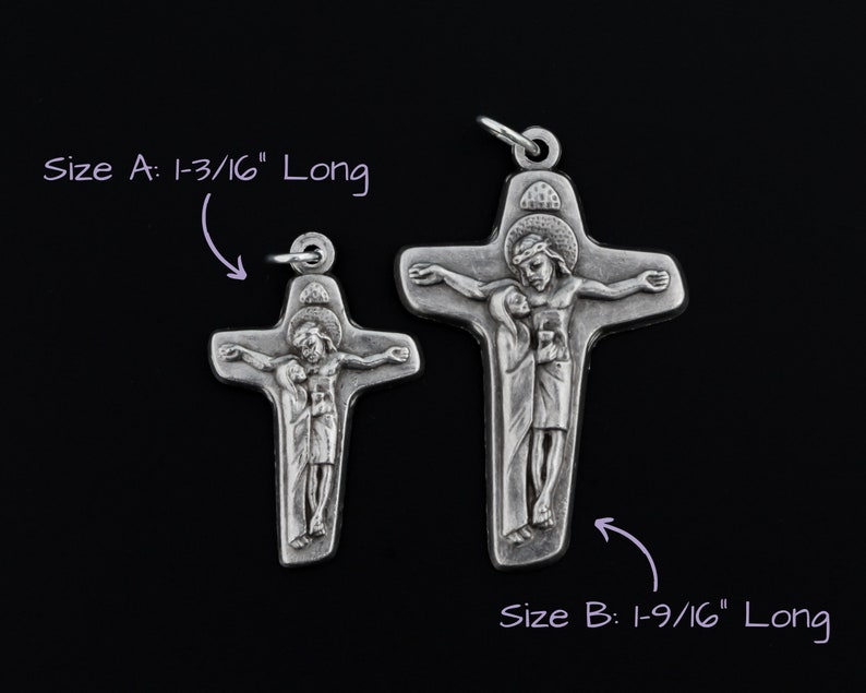May include: Two silver crucifixes with the image of Jesus Christ and Mary. The larger crucifix is 1-9/16 inches long and the smaller crucifix is 1-3/16 inches long.