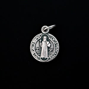 May include: Silver Saint Christopher medal with a green enamel background. The medal features a depiction of Saint Christopher carrying a child on his shoulders, with the words "S. Christopher" and "Protector" inscribed around the edge.