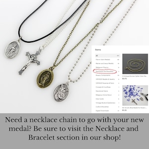 May include: Three silver and gold chain necklaces with religious medallions. The necklaces are displayed on a white background with a product listing for necklaces and bracelets. The listing shows a variety of religious items, including medals, rosaries, and crosses.