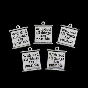 May include: Five silver scroll charms with the inscription "With God all things are possible".