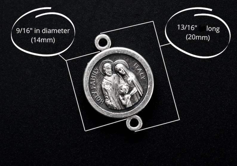 May include: A silver-colored Holy Family pendant, 9/16 inch in diameter and 13/16 inch long, with the words "HOLY FAMILY ITALY" inscribed. The pendant features a detailed relief of a family. The pendant has two loops for attachment.