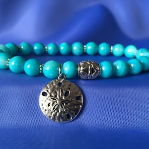 Muschel Armband, Muschel Schmuck, Sand Dollar Charme, Stretch Armband, Ocean Schmuck, Boho Schmuck, Perlen Armband, Geschenk für sie, Muscheln