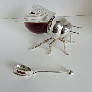 Silverfat och rött glas honungsbi-kruka Järngrindsprodukt Art Deco-stil Järngrind