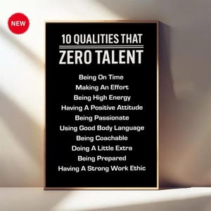 May include: A framed black and white print with the text "10 QUALITIES THAT ZERO TALENT" and a list of ten qualities. A red "NEW" sticker is in the upper left corner. The frame is gold.