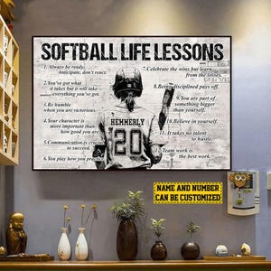 May include: Softball Life Lessons poster featuring a softball player with the name "Hemmerly" and the number "20" on the jersey. The poster includes inspirational quotes about life and sports. The text "Name and Number Can Be Customized" is also visible.