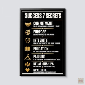May include: A black framed wall art print titled SUCCESS 7 SECRETS in gold text. It lists seven principles: Commitment, Purpose, Integrity, Education, Failure, Relationships, and Gratitude, each accompanied by a gold icon and a descriptive sentence.