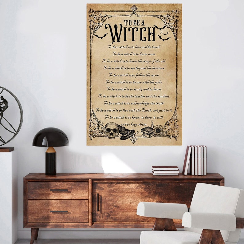 May include: A vintage-style print with a black and white illustration of a witch and a skull. The text reads "To be a witch is to love and be loved. To be a witch is to harm none. To be a witch is to know the ways of the old. To be a witch is to see beyond the barriers. To be a witch is to follow the moon. To be a witch is to be one with the gods. To be a witch is to study and to learn. To be a witch is to be the teacher and the student. To be a witch is to acknowledge the truth. To be a witch is to live with the Earth, not just in it. To be a witch is to know; to dare, to will, and to keep silent."