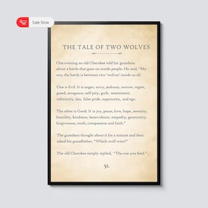 May include: A framed print with the text "THE TALE OF TWO WOLVES" in a serif font. The text describes a Cherokee tale about the battle between good and evil within people. The print has a vintage paper appearance and a black frame.