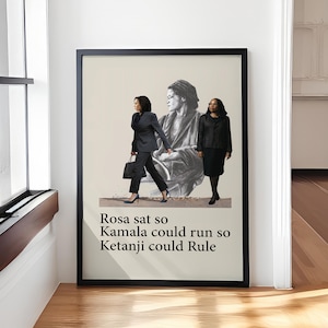 May include: Framed print with three women: Rosa Parks, Kamala Harris, and Ketanji Brown Jackson. Text at the bottom reads: "Rosa sat so Kamala could run so Ketanji could Rule."