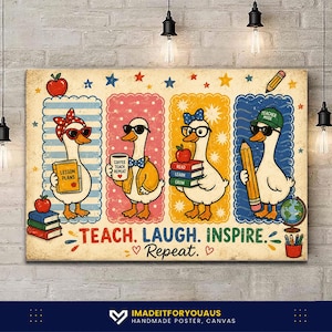 May include: A rectangular wall art print featuring four cartoon ducks in separate panels. The ducks wear glasses and accessories like bows and hats, holding items such as a lesson plan book, a coffee mug, books, and a pencil. Text reads: TEACH. LAUGH. INSPIRE. Repeat.