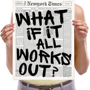 May include: A print of a newspaper page from The New York Times with the headline "WHAT IF IT ALL WORKS OUT?" in bold black letters. The newspaper is held up by a person.