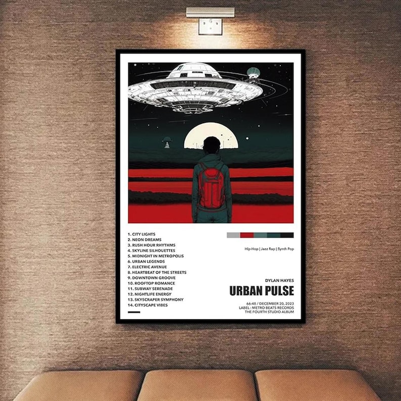 May include: A framed poster featuring a science fiction-themed album cover. The artwork depicts a person with a red backpack looking towards a UFO. The album title is "Urban Pulse" by Dylan Hayes, with a tracklist on the left. The album is labeled as Hip Hop, Jazz Rap, and Synth Pop.