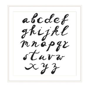 May include: Black cursive alphabet letters a through z, displayed on a white background within a white framed border. The letters are in a handwritten style, with varying stroke thicknesses.