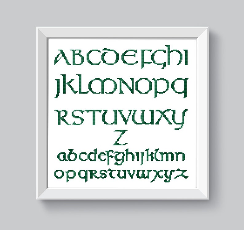 May include: A white framed image with a green alphabet in a Celtic font. The alphabet includes both uppercase and lowercase letters.