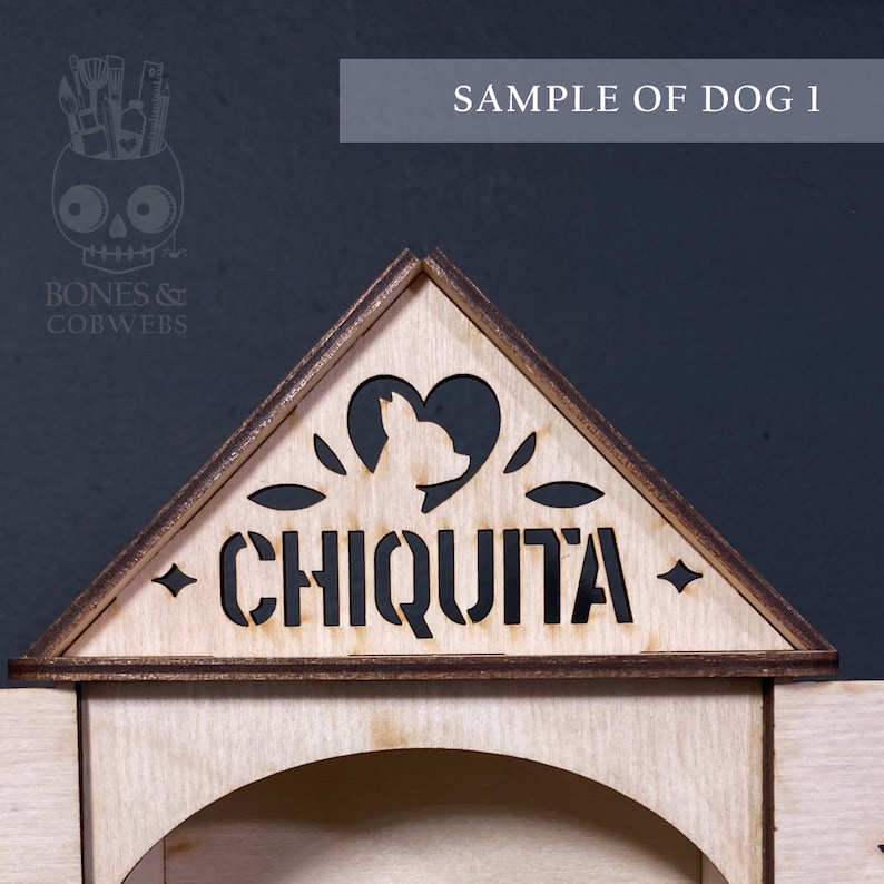May include: A light-coloured wooden triangular sign featuring a laser-cut silhouette of a dog head inside a heart shape. The word CHIQUITA is cut out in capital letters below the heart. The edges of the wood are dark brown, and the sign is triangular.