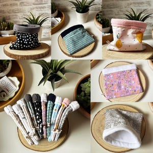 May include: A selection of small fabric pet beds and accessories. The beds display diverse patterns, such as polka dots, geometric designs, and floral prints. The accessories come in various colours, including grey, black, blue, and pink. Each item is presented on a wooden slice.
