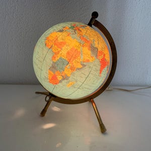 Globo terráqueo vintage de los años 70, Taride, trípode dorado, cristal - 23 cm