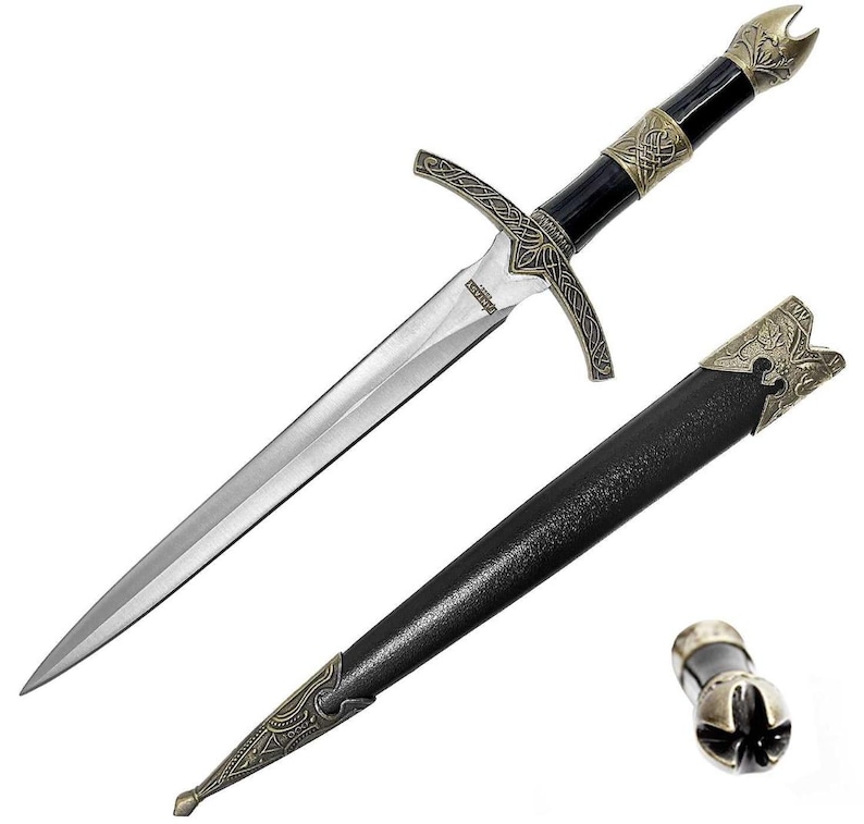 May include: A black and gold dagger with a leather sheath. The dagger has a decorative handle and a sharp blade. The sheath has a decorative metal tip.