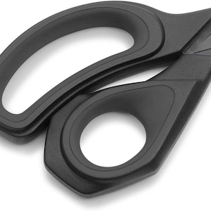 May include: Black plastic scissors with a curved handle and a sharp blade. The scissors are designed for cutting paper, fabric, and other materials.