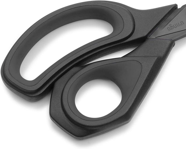 May include: Black plastic scissors with a curved handle and a sharp blade. The scissors are designed for cutting paper, fabric, and other materials.