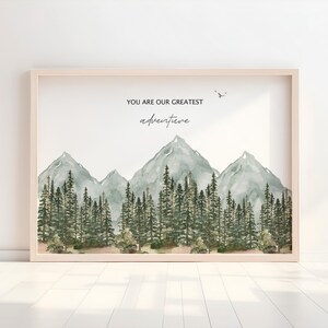a picture frame with a picture of mountains and trees