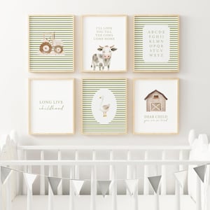 May include: A collection of six framed art prints with a farm theme. The prints feature illustrations of a tractor, cow, alphabet, goose, barn, and text. The color palette includes green, brown, and white, creating a cohesive nursery or children's room decor.