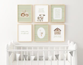 May include: A collection of six framed art prints with a farm theme. The prints feature illustrations of a tractor, cow, alphabet, goose, barn, and text. The color palette includes green, brown, and white, creating a cohesive nursery or children's room decor.