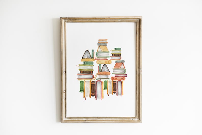 A framed watercolor painting depicting a stack of colorful books.