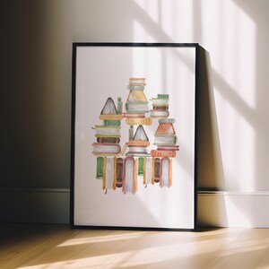 A framed watercolor painting depicting a stack of colorful books on a shelf.