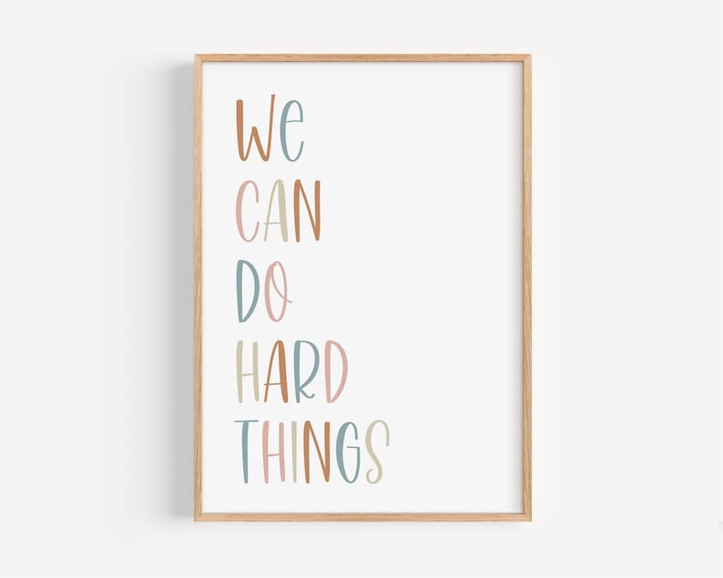 a framed poster with the words we can do hard things