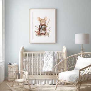 A nursery room with a wooden crib, a rocking chair, and a framed picture of a mouse wearing a knight's helmet on the wall.