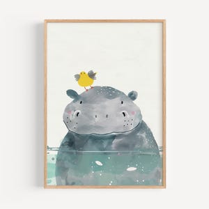 A framed illustration depicting a cartoon-style hippopotamus with a yellow bird perched on its head.