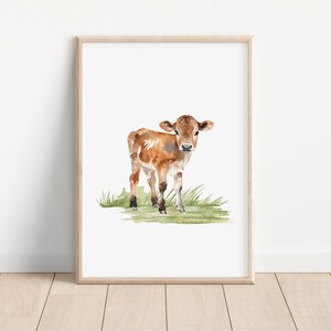 May include: Watercolor painting of a brown and white calf standing in a field of green grass.