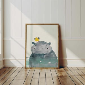 A framed illustration of a hippopotamus with a yellow bird perched on its head, set against a blue background with white lines.