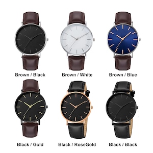 May include: Collection of minimalist wristwatches with various dial colors, including black, white, and blue. The watches feature leather bands in brown and black, with gold, rose gold, and silver cases. The image includes text labels: "Brown / Black", "Brown / White", "Brown / Blue", "Black / Gold", "Black / RoseGold", and "Black / Black".