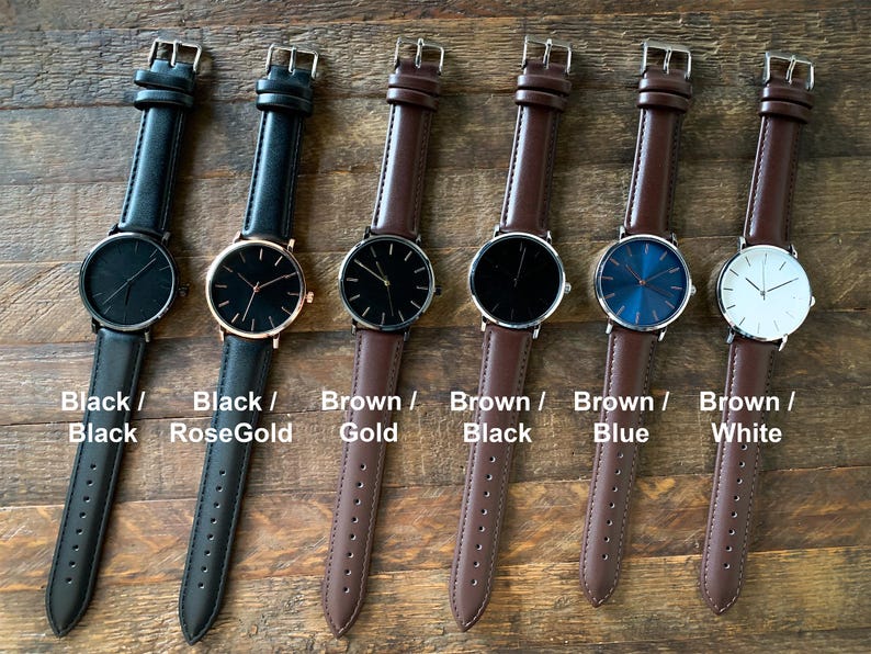 May include: Six minimalist watches with leather straps are displayed. The watches have black, rose gold, and gold cases, with black, blue, and white faces. The text on the image reads "Black / Black", "Black / RoseGold", "Brown / Gold", "Brown / Black", "Brown / Blue", and "Brown / White".