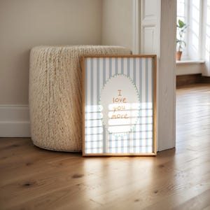 a picture frame sitting on a wooden floor