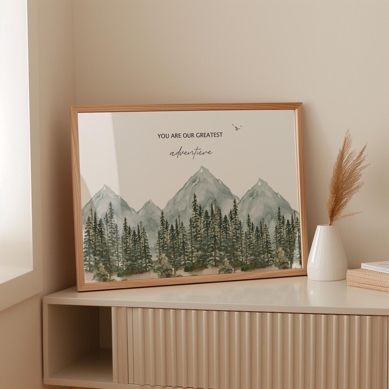 a picture frame sitting on a shelf next to a vase