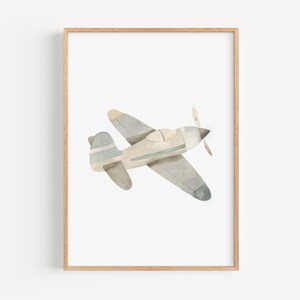 a framed picture of an airplane flying in the sky