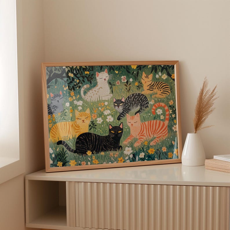 a picture of cats sitting on a shelf