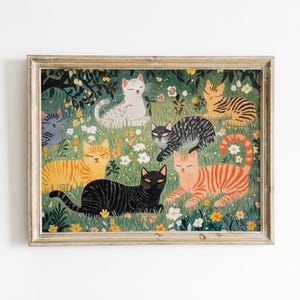 a picture of a group of cats in a field of flowers