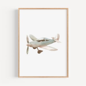 a framed photograph of an airplane flying in the sky