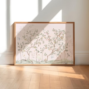 A large framed painting depicting a serene landscape with trees, birds, and a pond is displayed on a wooden floor against a white wall.