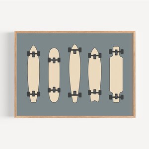 A framed illustration of five skateboards in various styles and designs, arranged in a grid-like pattern against a gray background.
