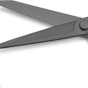 May include: Close-up of a pair of black scissors with a hot forged label. The scissors have a sharp, pointed blade and a comfortable handle.