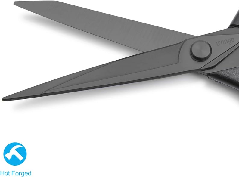 May include: Close-up of a pair of black scissors with a hot forged label. The scissors have a sharp, pointed blade and a comfortable handle.