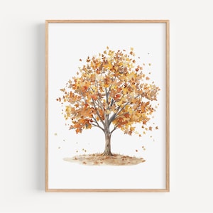 May include: Watercolor painting of a tree in autumn. The tree has a brown trunk and branches, with leaves in shades of orange, yellow, and brown. The artwork is framed in a light brown wooden frame, and is set against a white background.